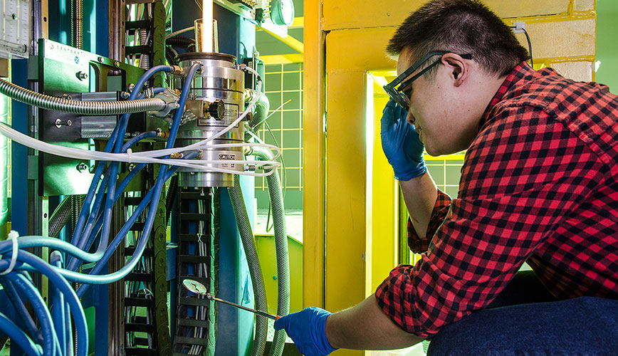 Student operates fiber draw tower